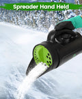 All Purpose Hand Spreader Shaker With Adjustable Opening Sizes And Flow Dial For Even Distribution Of Grass Seed Fertilizer Salt Ice Melt Up To 80 Oz Perfect For Lawn Care Gardening And Winter Driveway Maintenance in use on snowy path.