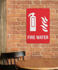 Built Tough Fire Water Supply Caution Sign 8 By 12 Inch No Rust Nonsense Reflective Aluminum Warning Plate With Bold Lettering For Industrial Plant Safety And Utility Zone Setup Daily on a brick wall.