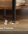Close-up of bottom corner of modern nightstand with charging station, showing rustic brown and black finish with floor protector detail.