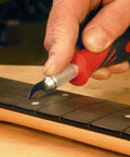 Using Refret Saw And Fret Slot Cleaning Tool Set For Guitar Fretboard Repair on neck with ergonomic grip and precision.