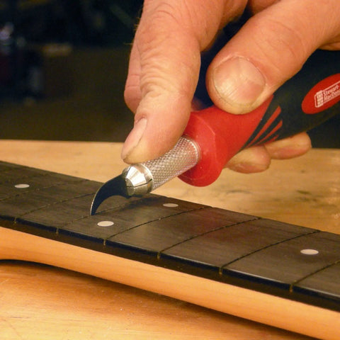 Using Refret Saw And Fret Slot Cleaning Tool Set For Guitar Fretboard Repair on neck with ergonomic grip and precision.
