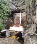 3000W Micro Hydroelectric Generator for Home and Outdoors Off Grid 220V installed near rocks and waterfall stream