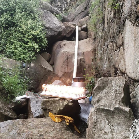 3000W Micro Hydroelectric Generator for Home and Outdoors Off Grid 220V installed near rocks and waterfall stream