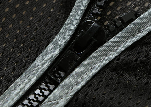 Close-up of zip front and mesh detail of Men's Black High Visibility Safety Vest With Zip Front And Cargo Pockets Class 2 Reflective Work Vest.