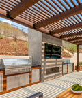 Outdoor patio with wooden pergola, stainless steel grill and TV. Part of a home construction project using 24 Pcs 2x4 Joist Hangers Set Q235B Steel.