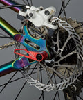 Ultralight Titanium Quick Release Skewer Set For Mountain Bike Red Beefed Up For Maximum Strength in rear wheel close-up view.
