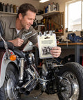 Grab This 12-Pack Of Pro Grade 1/4 Inch 28 Unf Stainless Zerk Grease Nipples For Your American Ride With A Leak Free Seal That Keeps Your Chassis Smooth And Fully Lubed For The Long Haul. man holding stainless zerk grease fitting kit for motorcycle chassis