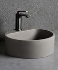 Top Tier Grey Terrazzo Round Vessel Sink 15.7 Inches Above Counter Bathroom Vanity Basin with black faucet.