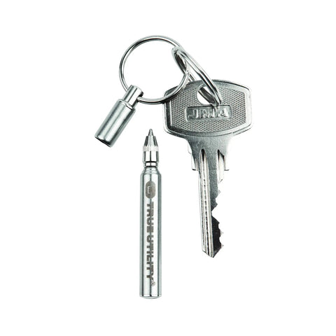 Telescoping Stainless Steel Keychain Ballpoint Pen With Ink Refills Ultra Compact Pocket Pen next to a metal key