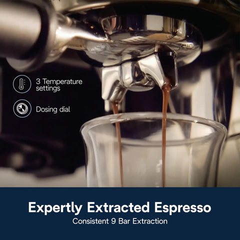 Close-up of compact espresso machine with built-in burr grinder and milk frother for a home barista kit brewing espresso shot.