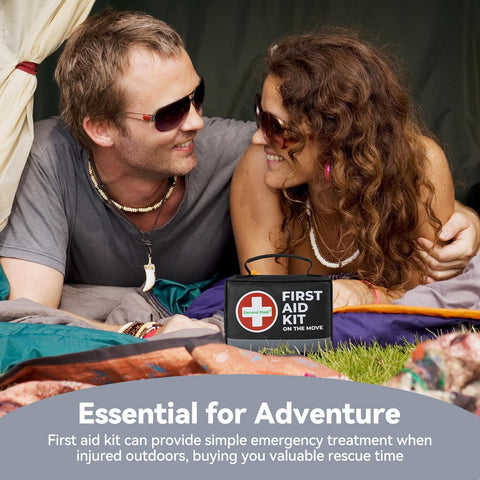 Couple in a tent with Compact 150 Piece First Aid Kit With Instant Cold Pack And Emergency Blanket for adventure travel.