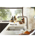 Riverby White Rinsing Colander With Built In Cutting Board on modern kitchen sink, showcasing sleek durable design.
