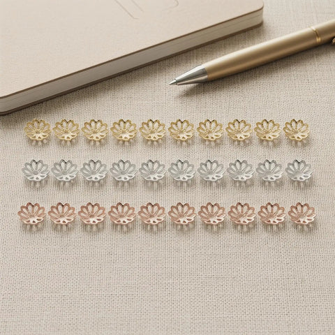 Natural Metal Bead Caps And Flower Spacer Pendants For DIY Jewelry Making 0.27 Inch End Caps in gold, silver, copper on fabric