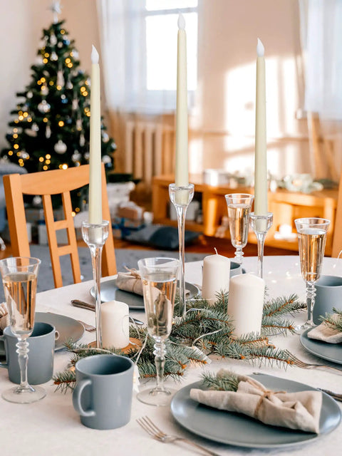 36 Piece Flameless Taper Candles Set With Flickering LED Light setup on a festive holiday table with Christmas decor.