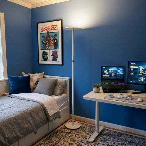 Sky LED Floor Lamp Torchiere Lit And Super Bright Dimmable Tall Standing Lamp in a blue bedroom with desk and computer setup.