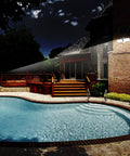 Illuminated house and pool using Solar Powered AI Smart Motion Dual Head LED Flood Light 10W 1200 Lumens Outdoor Security Glow No Fuss.