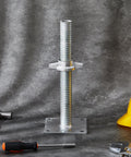 Heavy Duty Adjustable Leveling Jacks With Base Plate For Baker Scaffold System on gray background, close-up of galvanized steel jack.
