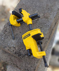 Yellow MaxSteel Multi Angle Hobby Vice with 360-Degree Ball Joint on concrete surface, pro grade build, black accents