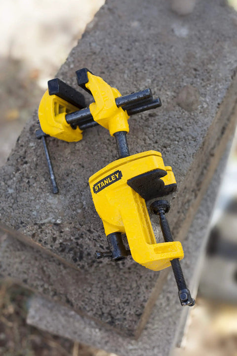 Yellow MaxSteel Multi Angle Hobby Vice with 360-Degree Ball Joint on concrete surface, pro grade build, black accents
