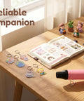 Compact Mini Heat Gun With Dual 482℉/662℉ Settings on a table with DIY craft materials and keychains.