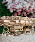 Luminous Zeppelin LED 3D Wooden Puzzle Kit For Adults displayed on stand with intricate details, airship shape visible.