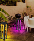 Solar Patio Floor Lamp 2 Pack Waterproof RGB Color Changing Garden Path Lights for Porch Lawn Yard and Backyard with All Night Endurance and 12 Hour Battery Life Cordless Landscape Lighting illuminating patio.