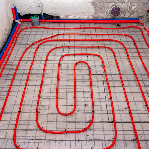 Meccanixity Steel Spring Pipe Bender For 1 Inch Pvc Tube, 39 Inch Long Bending Tool creating smooth bends in red pipe layout.
