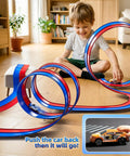 Child playing with 15 Ft Flexible Race Track Set For Kids Ages 3 8 With 2 Small Cars in living room