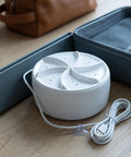 Portable Mini Turbo Washer Compact Automatic Laundry Beast For Dorm Rooms And Apartments Travel Friendly Design That Slaps With Rapid Spin Cycle on a wooden surface.