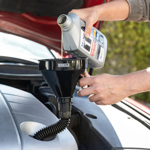 Black funnel from Color Coded Automotive Flex Funnel Kit With Hose And Mesh Filter 2 Pack Wide Mouth Oil Funnel in use