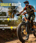 Man riding Dual Motor 6000W Fat Tire Electric Mountain Bike For All Terrain Adventures, showcasing hydraulic brakes on trail