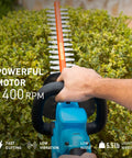Man using Cordless Hedge Trimmer With 22 Inch Dual Action Blades 20V 4Ah Battery Included Fast Charger And Safety Goggles on bush