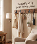 Heavy Duty Kickass Cast Iron Wall Hooks 5 Pack Handmade Blacksmith J Hooks for hanging bags and coats in a cozy living room.