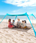 Pop Up Beach Tent Sun Shelter Grande 10x10ft Canopy With 4 Stability Poles, group of friends relaxing under shade on beach