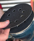 Gator Auto Hook And Loop Ceramic Sanding Discs With Quick Change System for 180 grit blending, being attached to a sander.