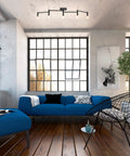 Living room with Tempo Foldable Track Lighting Bar With 4 Pivoting Joints In Matte Black Finish 5 Light Adjustable Track Light