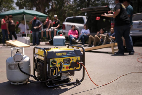 5500 Watt Dual Fuel RV Ready Portable Open Frame Inverter Generator with propane tank in outdoor gathering