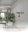 Wall with 2 Pack Black Wall Hooks for Bathroom And Kitchen, Heavy Duty Towel And Coat Hooks, holding bags and a hat, in a dining room.