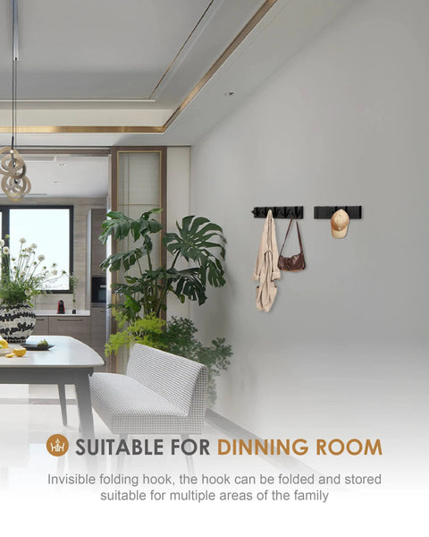 Wall with 2 Pack Black Wall Hooks for Bathroom And Kitchen, Heavy Duty Towel And Coat Hooks, holding bags and a hat, in a dining room.