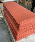 Stack of red heat resistant silicone sponge foam rubber sheets, textured surface for high temp press, 11.8x11.8 inch, 1.5 mm thick