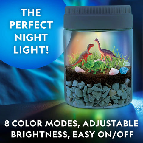 Light Up Dino Terrarium Science Kit For Kids With Multicolor LED Light And Eight Settings, Build A Colorful Mini Dino World, Decorate With Figurines, Rocks, And Stickers, Plant Seeds, Watch It Grow And Glow. Dino terrarium jar with 3 figurines and rocks