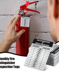Heavy Duty Aluminum Fire Extinguisher Tags Bulk Pack Featuring Monthly 2026 To 2029 Dates on a fire extinguisher.