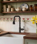 Vintage Kitchen Sink Faucet With Pull Down Sprayer And Single Handle, oil rubbed bronze finish in rustic kitchen setting.