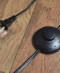 Modern Black Floor Lamp With K9 Clear Glass Crystals foot switch and plug, showing power cord on wooden floor.