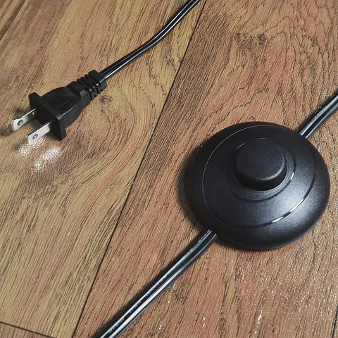 Modern Black Floor Lamp With K9 Clear Glass Crystals foot switch and plug, showing power cord on wooden floor.