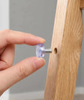 Hand installing 40 Piece Adjustable Furniture Feet Levelers For Cabinets And Garden Furniture, M6 Threaded PVC and metal, anti wobble