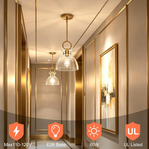 Super Sleek Brushed Gold Pendant Light For Kitchen Island Featuring Fully Adjustable Hanging Cord And Large Clear Glass Shade Creating A Lowkey Modern Vibe For Dining Room Decor in a stylish hallway.