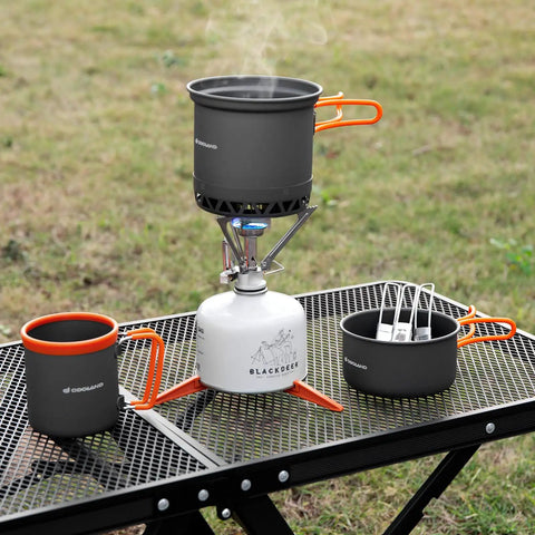 Backpacking Cooking Kit With 1300W Stove 0.6L And 0.8L Pots Canister Stabilizer Spoon Fork Knife 16oz Mug Mesh Carry Bag Grab And Go Camp Kitchen For Hiking And Picnics displayed on a table.