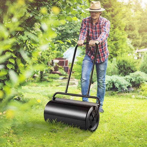 Man using Large Capacity Lawn Roller 13 Gallon Heavy Duty Steel Sand Or Water Filled With Easy Turn Plug And U Shaped Ergonomic Handle for smooth garden lawn