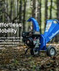 Compact Mini Wood Chipper Shredder Mulcher with 7HP power in forest, large wheels for easy maneuvering, extended chute